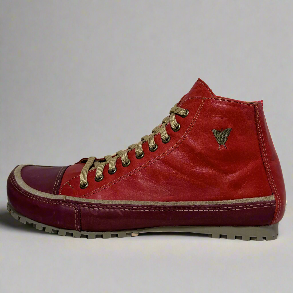 Red high-top sneaker with beige laces on a white background