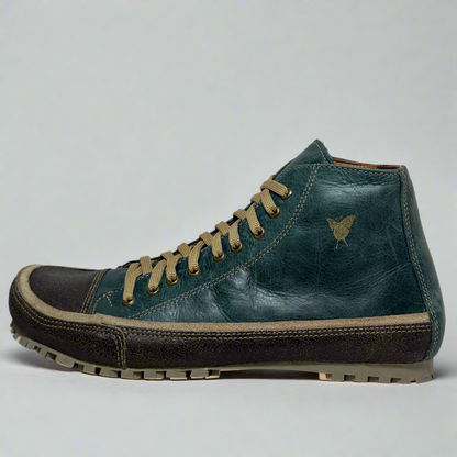 Blue leather boot with brown laces on a white background